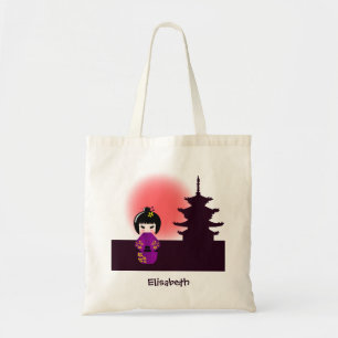 Japansk kokeshi-docka vid templet under solnedgån tygkasse