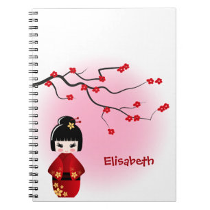 Japansk kokeshi-doll vid sakura-blommar anteckningsbok med spiral