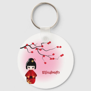 Japansk kokeshi doll vid sakura blommar namn nyckelring