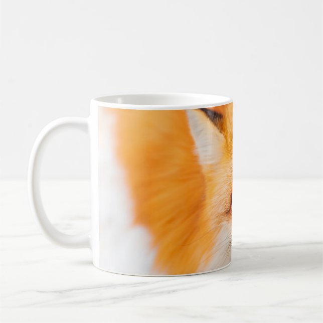 Japansk rödräv som vilar, sover och spelar in  kaffemugg (Vänster)