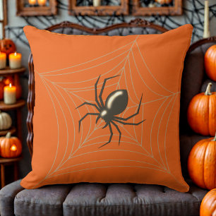 Jättehalloween-spindel i sitt nät orange bakgrund kudde