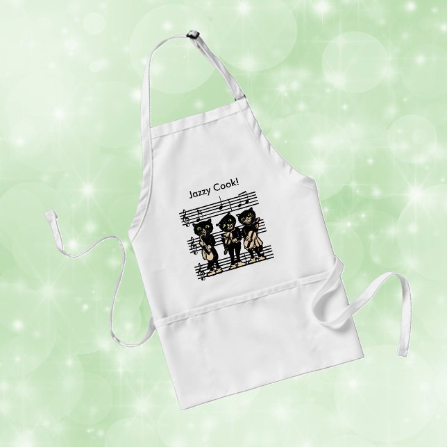 Jazzy Cook Musiker Svarta Katter Förkläde (Three black cats playing music green eyes on sheet of black music notes.)