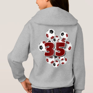 jersey-nummer på en grupp fotbollar-maron t shirt