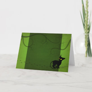 Jinxen tar ett gåhälsningkort kort