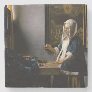 Johannes Vermeer - Woman Holding a Balance Stenunderlägg