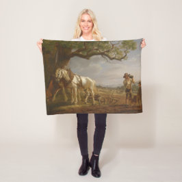 Jordbrukare som ligger i en Fält med hästar och bl Fleecefilt