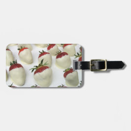 Jordgubbar som doppas i vitchoklad bagagebricka