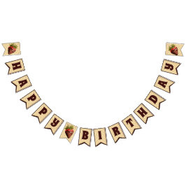 Jordgubbar täckta av choklad med grattis på födels vimplar