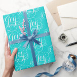 JOY Lettering Fashionable Flourzed Aqua Blue Presentpapper<br><div class="desc">Ta med lite JOY i din gåva ge med den här kritkalligrafin på ett fantastiskt modernt färg - precis som en juvelbox med den vita bokstaven "glad" som roterar som ett vitt band. Perfekt för en bröllop-gåva och som säger att julen alltid måste vara röd. Professionellens handbrev från Ivan Angelic...</div>