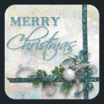 Jude Teal och Silver Joy till världen Fyrkantigt Klistermärke<br><div class="desc">Riktigt lagrad design i djup teal och silver med satingband, pärlor, en silver-filigree-stjärna, diamant nyckel, silver ornament och holly. Texten präglas av en liten aning glitter. Bakgrunden är texturerad och nedtryckt med dubbla högdagrar. Anm.: Skuldade, graverade, präglade och dimensionella effekter, skiktade, åldras eller eroderade utseenden, struktur och skuggor som uppnås...</div>