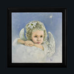 Jul Angel Minnesask<br><div class="desc">Julängen. Original oljemålning efter artist Liz Viztes. En ängel vilar på fluffa moln under Berlehem-stjärnan i serene blå himmel ovan. Hon blickar tanklöst medan hon väntar firande på Jesus födelse. Helgdag 2024.</div>