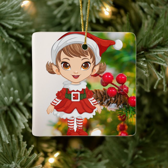 Jul Elf Ceramic Square Ornament (Elf is dressed in a festive red and white outfit, stands against a backdrop of a decorated tree.)