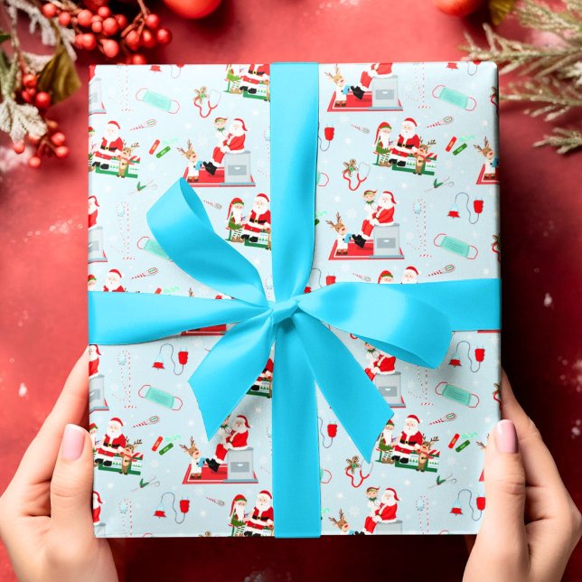 Jul för läkare med tomte i ljusblå presentpapper (Skapare uppladdad)