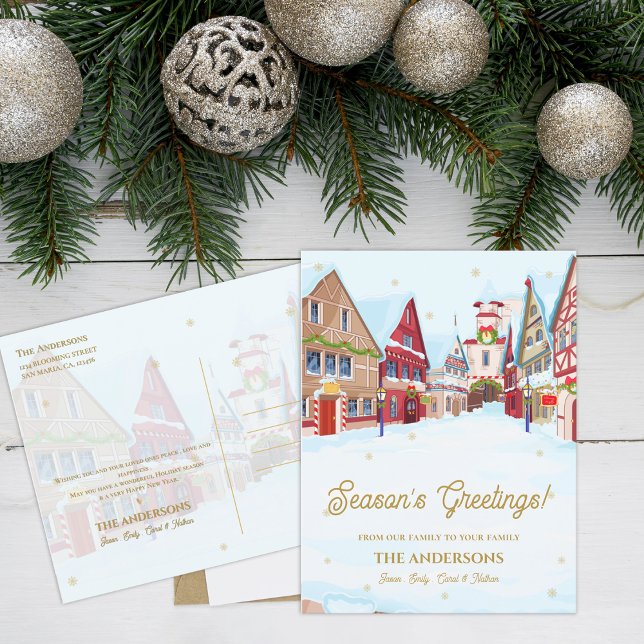 Jul i byfamiljen Hälsning Snowy Vykort (Season’s Greetings Snowy Village Family Christmas Postcard)