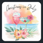 Jul i juli Tropiska Beach Sommaren Party Fyrkantigt Klistermärke<br><div class="desc">Den tropiska jultomten i juli-klistermärken eller kuvertsälar har en solnedgång med vattenfärg,  cocktails,  hibiscus-blommor och handflatan-löv med texten "Jul i juli" i handskrivet stil-brev.</div>
