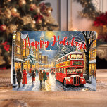Jul i London: Red Buss Street Scene Helgkort<br><div class="desc">feststämningen med vår jul i London: Red Buss Street Scene Helgdag Card! Det här charmeringskortet innehåller en vackert utförlig illustration av en klassisk röd dubbla-decker buss som kör genom en snöig, bustande London-gata under julhelgen. Perfekt för att skicka varmt helgdag till vänner och familj fångar detta kort den ikoniska charmen...</div>