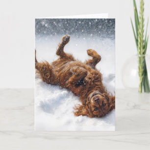 Jul Irish Setter gör en snöängel Helgkort