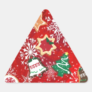 Julbakelser och snöflingor på rött triangelformat klistermärke