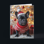 Julens Fransk Bulldog med Santa Hat Kort<br><div class="desc">En svart Fransk bulldog i en röd och vit strimlad svettare sitter på en vit päls matta. Text kan ändras.</div>