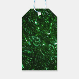 julgran tinsel med stor grönt presentetikett