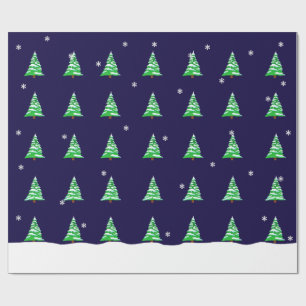 Julgranar i snön som slår in papper presentpapper
