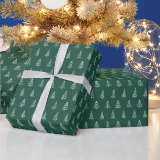 Julgranar på modern grön pappersrulle presentpapper