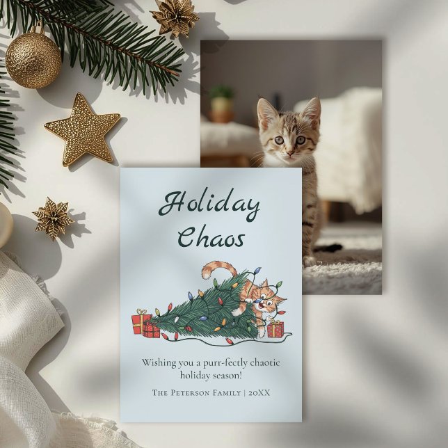 Julkaos Rolig Katt Julkort (Holiday Chaos Funny Cat Christmas Card on a table with gold and white Christmas decor.)