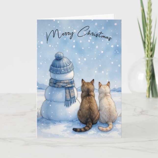 Julkatten sitter med en snöman i ett fält kort (Framsida)