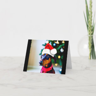 Julkort med Doberman i julhatt Helgkort