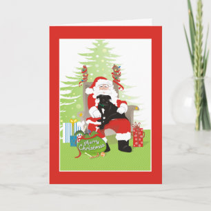 Julkort - svart groptjurhund på Santas varv Helgkort