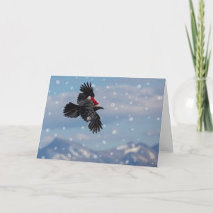 Julkråka svävande över snöiga berg kort