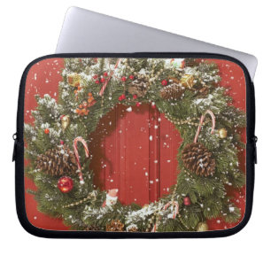 Julkran som hänger på en dörr laptop sleeve