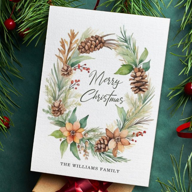 Julled krans med kottar bär lövverk julkort (Skapare uppladdad)