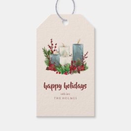 Julljus med blommor och bär presentetikett