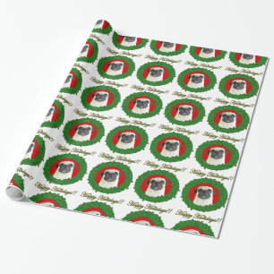Julmops som slår in papper presentpapper