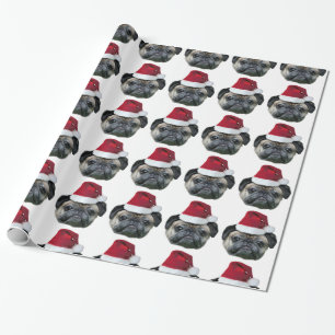 Julmops som slår in papper presentpapper