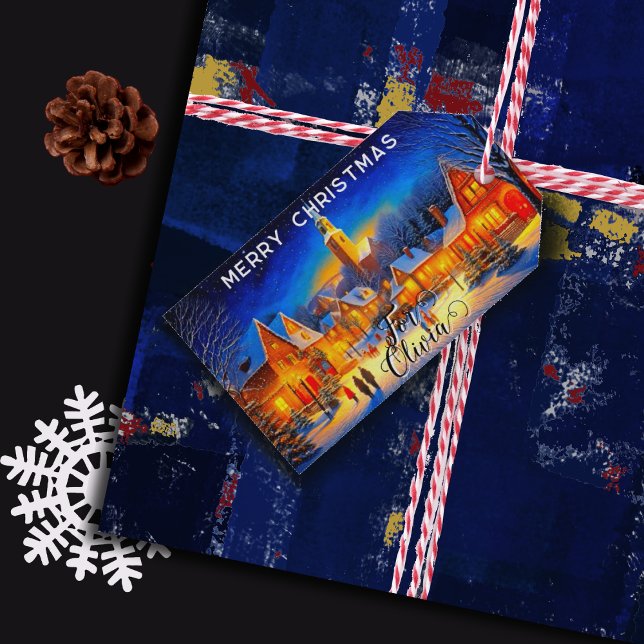 Julnatt i en belyst by presentetikett (Skapare uppladdad)