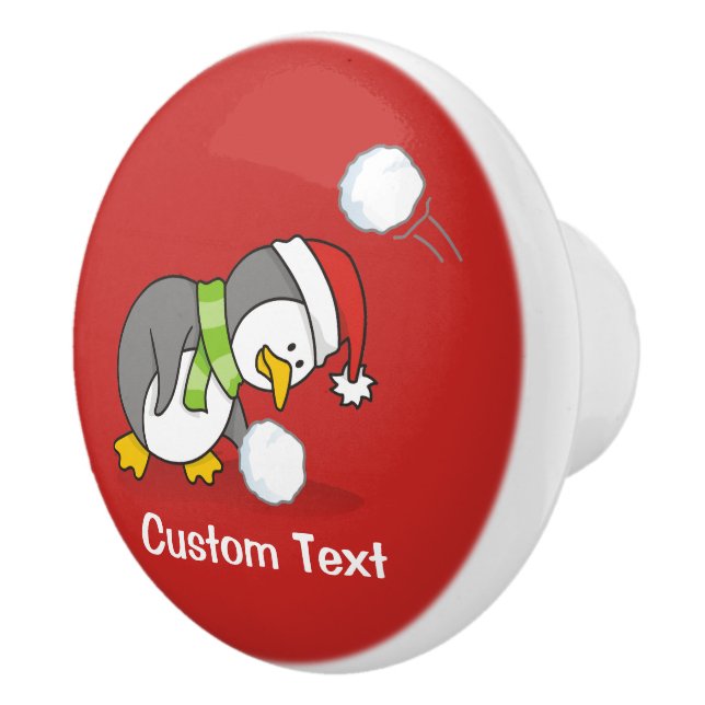 Julpenguin får en snö boll knopp (Höger)