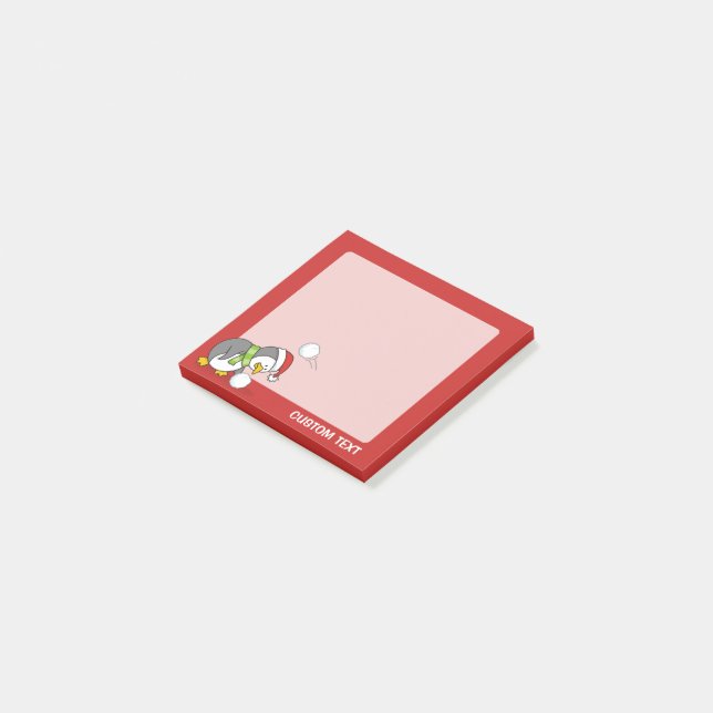 Julpenguin får en snö boll post-it block (Vinklad)