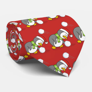 Julpenguin får en snö boll slips