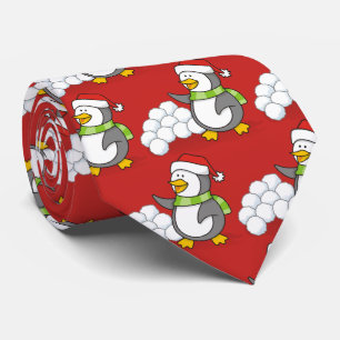 Julpenguin med snö bollar som viftar slips