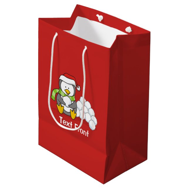 Julpenguin sitta med snö bollar (Framsidan Vinklad)