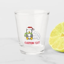 Julpenguin sitta med snö bollar