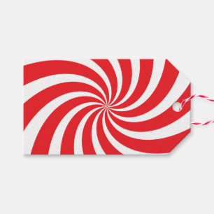 Julpepparmintcandy cane virvlar runt den röda presentetikett