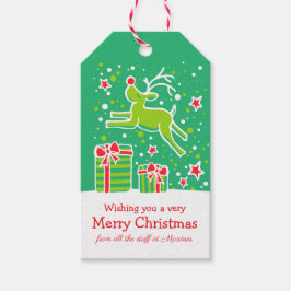 Julrenar som pranserar på gåvor grönt röd presentetikett