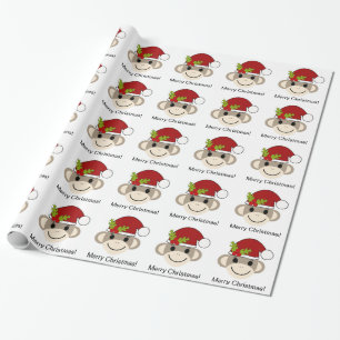 Julsock monkey som slår in papper presentpapper