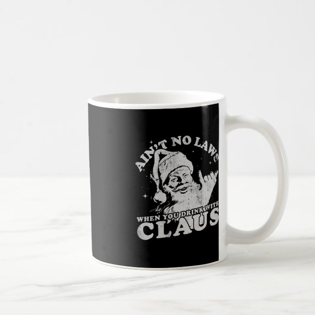 Jultomten är ingen lag när man dricker med kaffemugg (Höger)