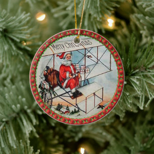 Jultomten flyger ett gammalt flygplan julgransprydnad keramik