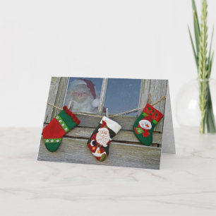 Jultomten i ladugårdsfönstret helgkort
