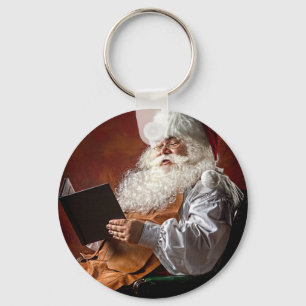Jultomten läser bok nyckelring